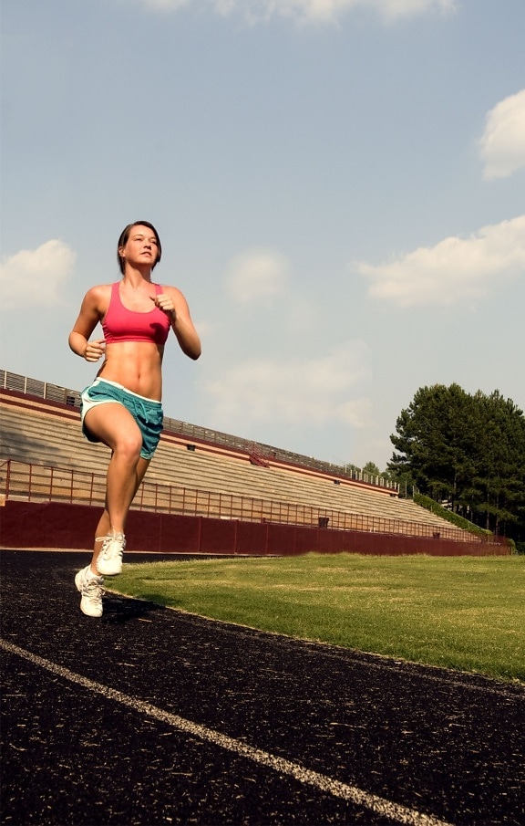 young woman, jogging, high legged technique