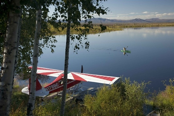 float, plane, lake, man, canoeing